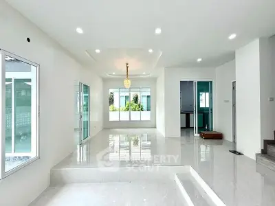 Spacious modern living room with glossy floors and large windows