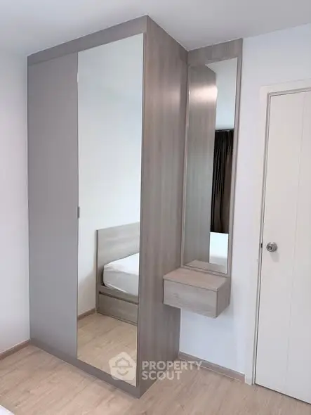 Modern bedroom with sleek wardrobe and minimalist design