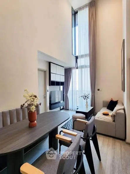 Modern living room with high ceilings and elegant decor