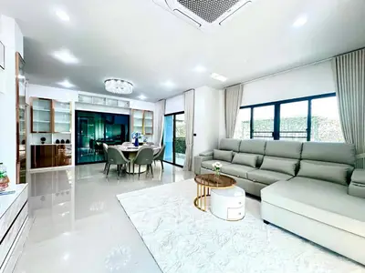 Spacious modern living room with elegant decor and dining area