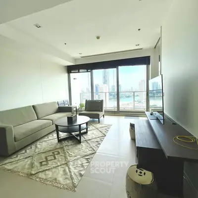 Modern living room with city view, stylish furniture, and large windows.