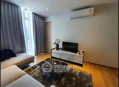 Modern living room with sleek furniture and air conditioning, perfect for comfortable living.
