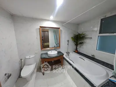 Spacious bathroom with modern fixtures and elegant marble design