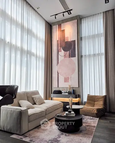 Luxurious modern living room with high ceilings and elegant decor