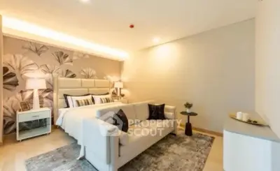 Luxurious bedroom with elegant decor and cozy seating area