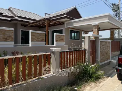 Charming single-story house with modern design and spacious outdoor area, perfect for family living.