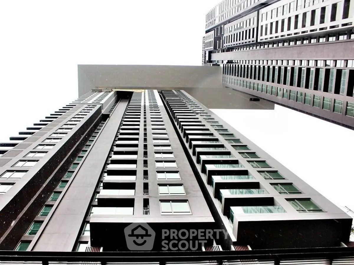 Stunning modern high-rise building with unique architectural design and sleek facade.