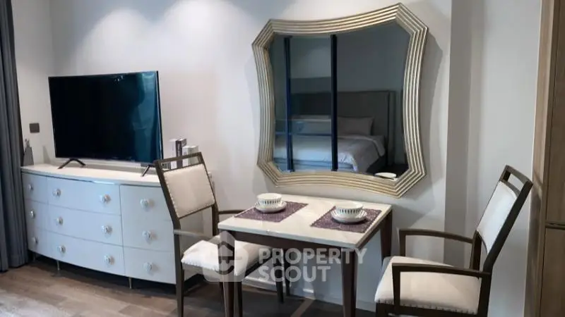 Chic modern living room with elegant dining set and stylish mirror