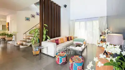 Spacious modern living room with vibrant decor and natural light