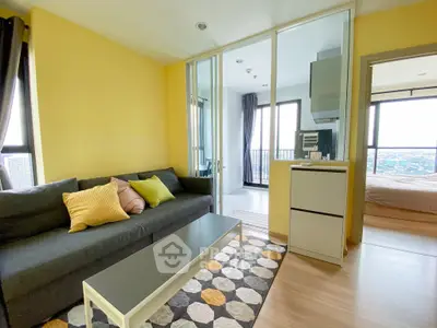 Modern living room with vibrant yellow walls and city view balcony