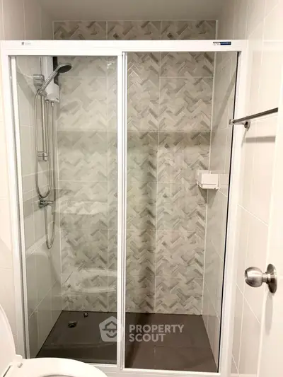 Modern bathroom with sleek shower enclosure and stylish tile design