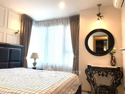 Elegant bedroom with stylish decor and natural light