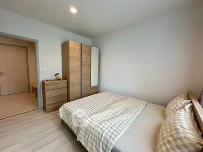 Cozy bedroom with modern wooden furniture and soft lighting