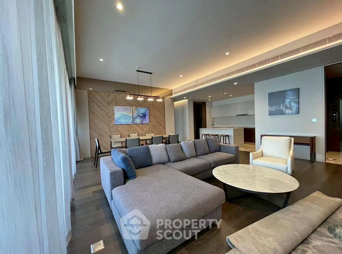 Spacious modern living room with elegant decor and open kitchen layout