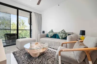 Modern living room with stylish furniture and large balcony view