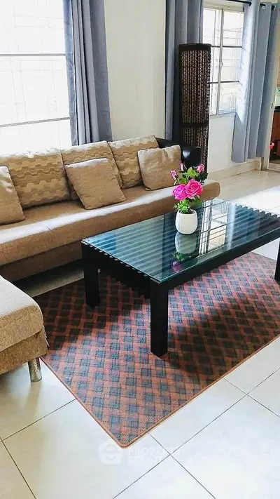 Stylish living room with modern sofa and glass coffee table