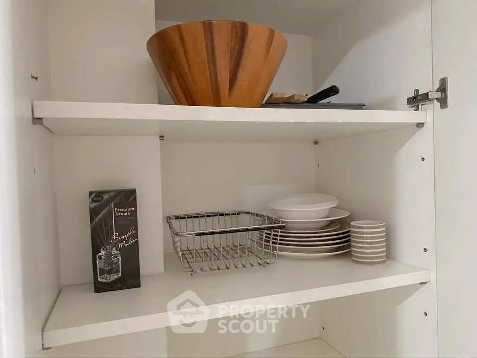 Modern kitchen storage with wooden bowl and elegant dishware