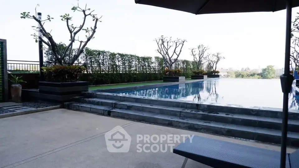 Luxurious rooftop infinity pool with stunning city views and elegant landscaping.