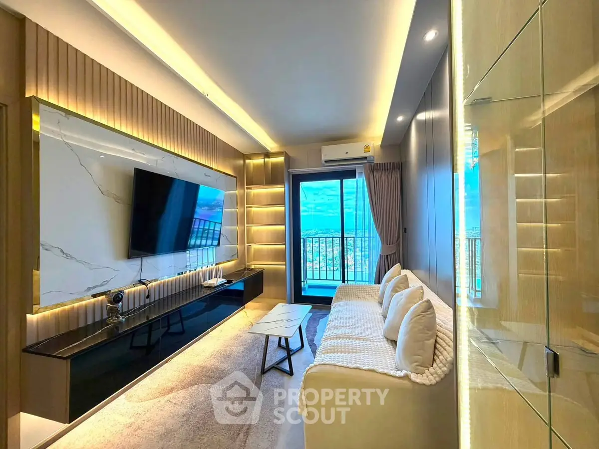 Luxurious modern living room with large TV and balcony view