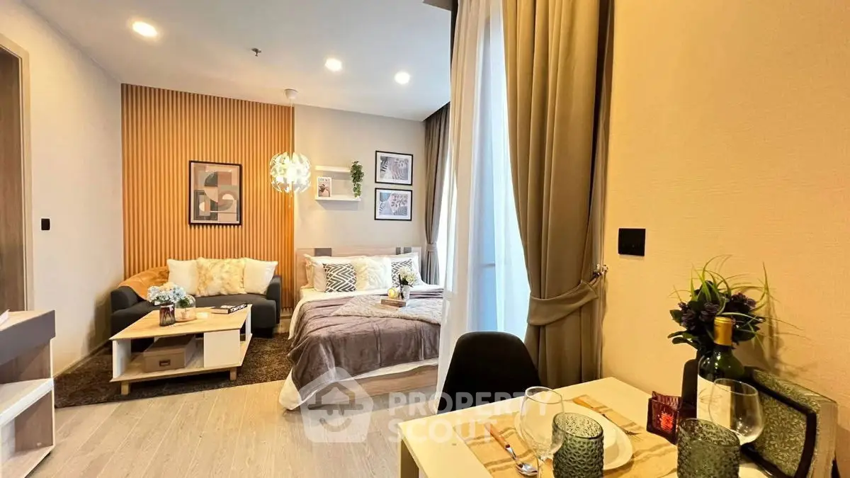 Stylish modern living room with cozy decor and elegant dining setup in a contemporary apartment.