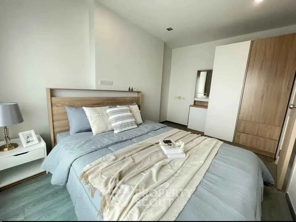 Cozy and modern bedroom with stylish decor and ample natural light