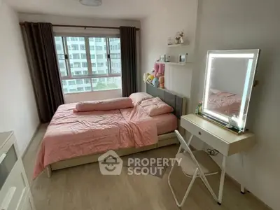 Cozy bedroom with large window and stylish vanity in modern apartment