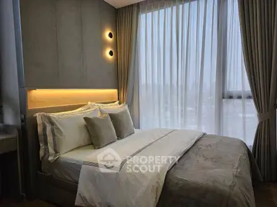 Luxurious bedroom with modern design and floor-to-ceiling windows offering stunning city views.