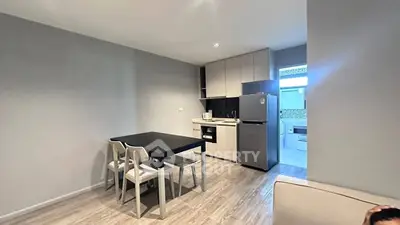 Modern kitchen with dining area and sleek appliances in open layout