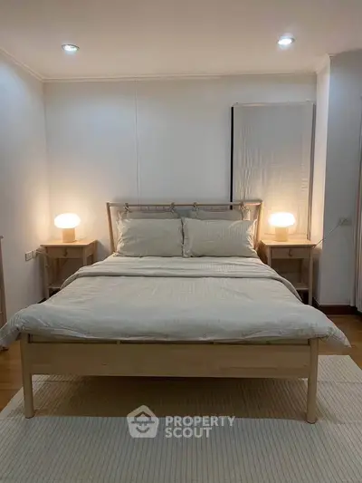 Cozy bedroom with modern wooden bed and soft lighting