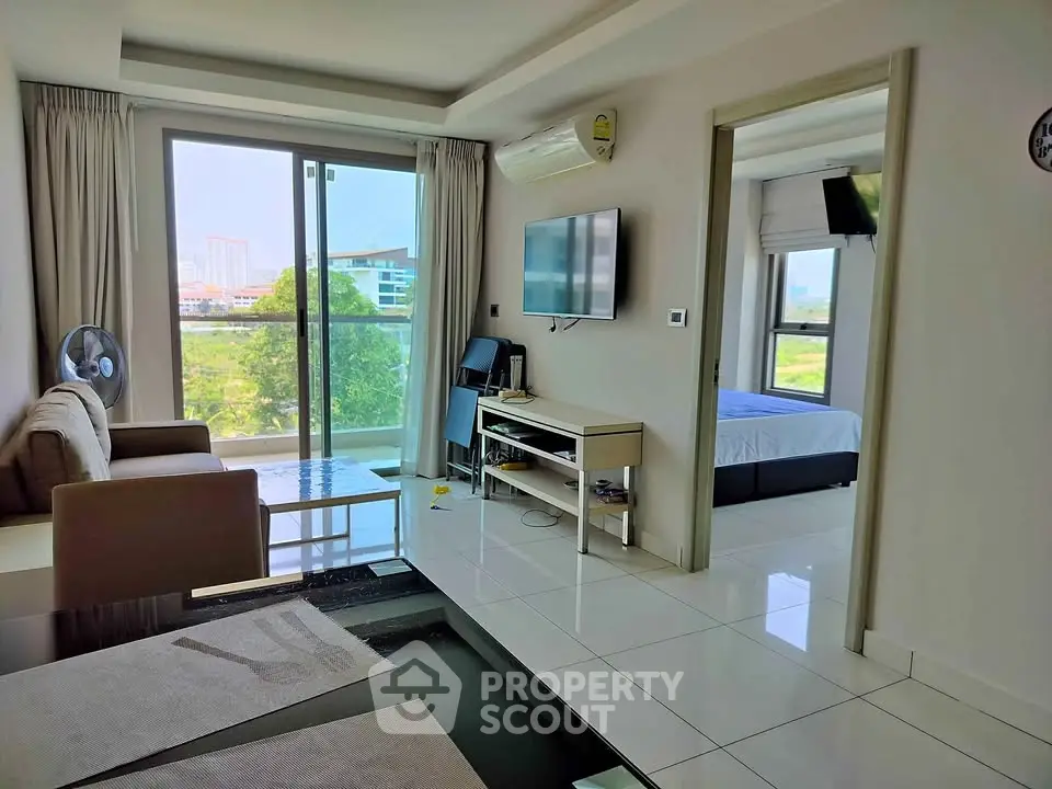 Modern living room with balcony view and sleek interior design
