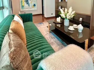 Luxurious living room with plush green sofa and elegant decor