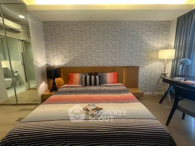 Modern bedroom with stylish decor and cozy ambiance, featuring a comfortable bed and elegant lighting.
