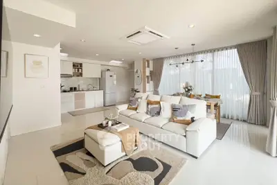 Spacious modern living room with open kitchen and elegant decor