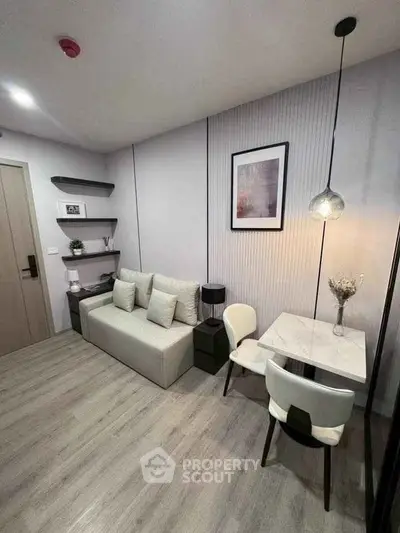 Modern living room with sleek furniture and stylish decor in a cozy apartment.
