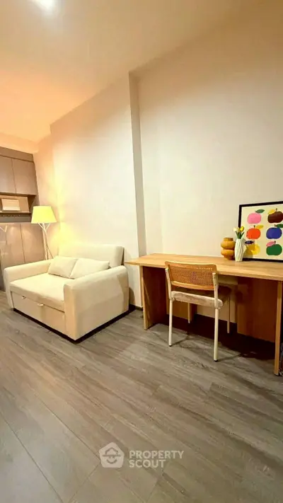 Modern living room with stylish sofa and minimalist desk setup