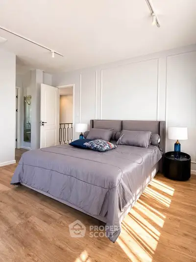 Spacious and bright bedroom with modern decor and natural light