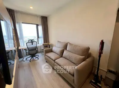 Modern living room with cozy sofa and city view from large window