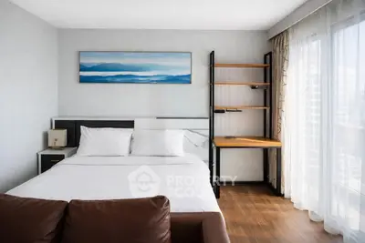 Modern bedroom with large window and stylish decor