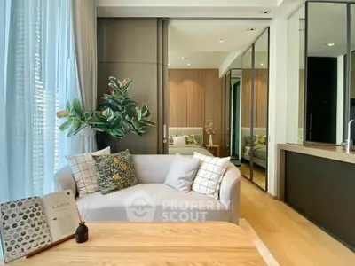 Modern living room with stylish decor and natural light, featuring a cozy sofa and elegant wooden accents.