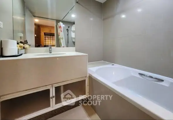 Modern bathroom with sleek design and bathtub in a contemporary home.
