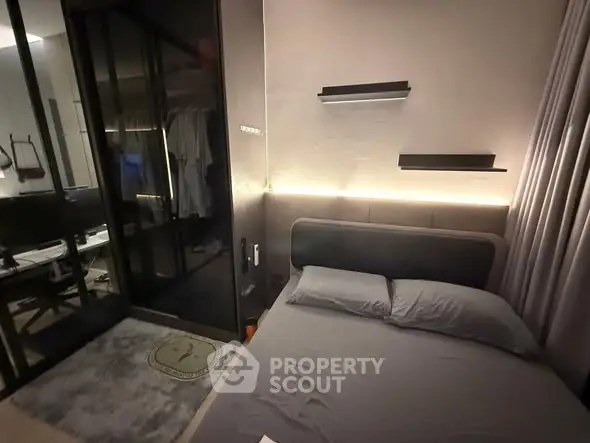 Modern bedroom with sleek design and ambient lighting