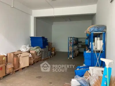 Spacious storage room with organized shelves and ample space for inventory.