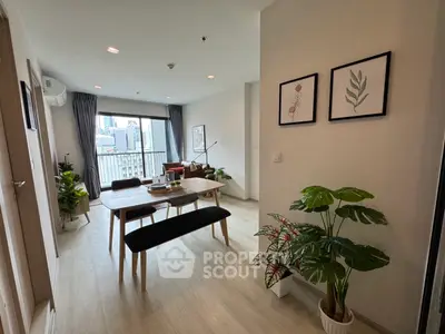 Modern living room with city view, stylish decor, and natural light