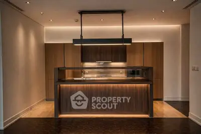 Luxurious modern kitchen with sleek wooden cabinetry and ambient lighting