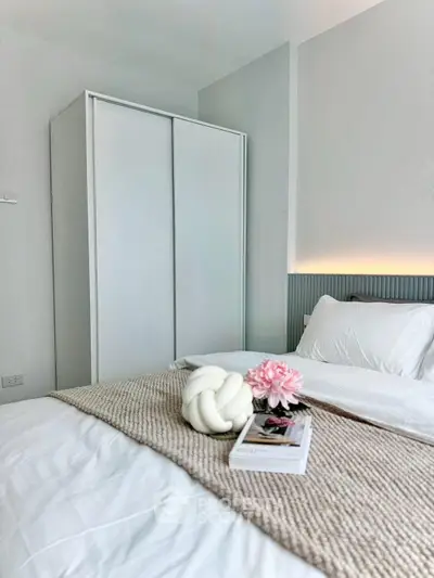 Modern bedroom with cozy decor and sleek wardrobe design