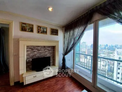 Charming living room with city view and elegant decor in high-rise apartment.