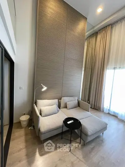 Spacious modern living room with high ceilings and elegant decor