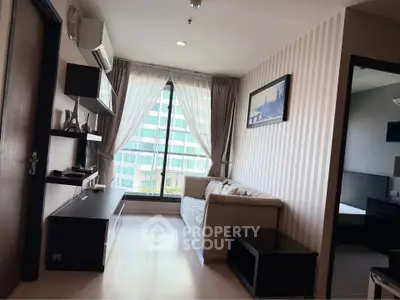 Modern living room with large window and stylish decor in urban apartment