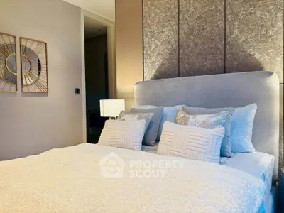 Luxurious bedroom with plush bedding and elegant decor, perfect for relaxation and comfort.