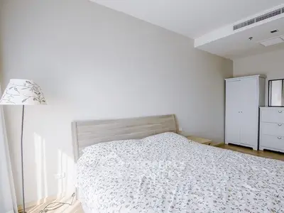 Bright and cozy bedroom with modern furniture and natural light